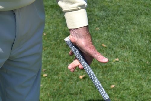 1 The butt end of the club must sit inside the fatty muscle of the left hand for a secure hold on the club throughout the swing.