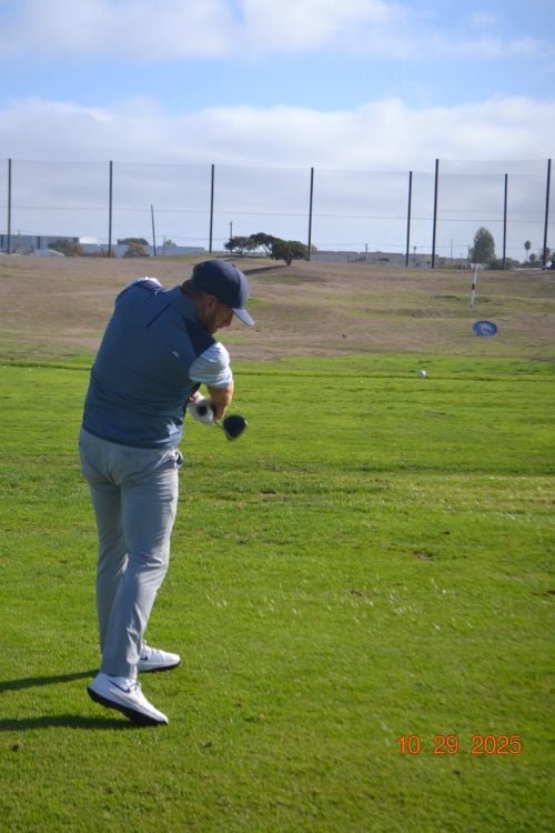 IMAGE 1 Swinging through impact and on line to the target