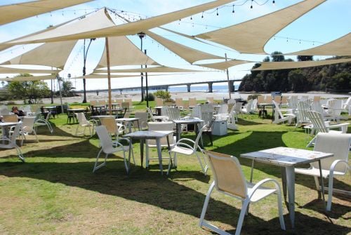 Shaded tables at Mulligans at Avila Beach Resort